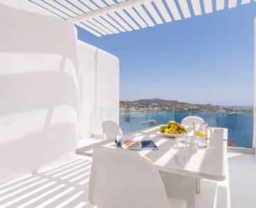 Breakfast table with sea view at Villa Aquablue in Agios Lazaros, Mykonos