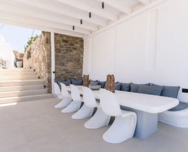 Long outdoor dining table at Villa Aquablue in Agios Lazaros, Mykonos