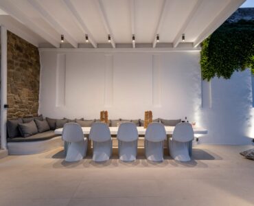 Covered outdoor lounge and dining at Villa Aquablue in Agios Lazaros, Mykonos