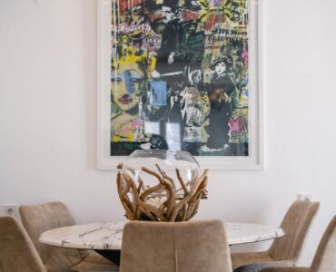 Dining table with artwork at Villa Aquablue in Agios Lazaros, Mykonos