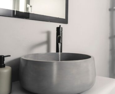 Bathroom with stone basin at Villa Aquablue in Agios Lazaros, Mykonos