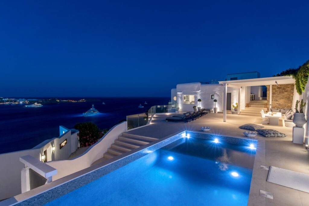 Pool at dusk with sea view at Villa Aquablue in Agios Lazaros, Mykonos