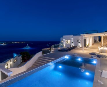 Pool at dusk with sea view at Villa Aquablue in Agios Lazaros, Mykonos