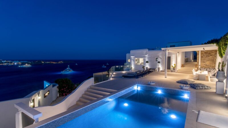 Pool at dusk with sea view at Villa Aquablue in Agios Lazaros, Mykonos