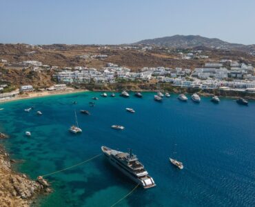 Aerial view of Psarou bay at Villa Aquablue in Agios Lazaros, Mykonos