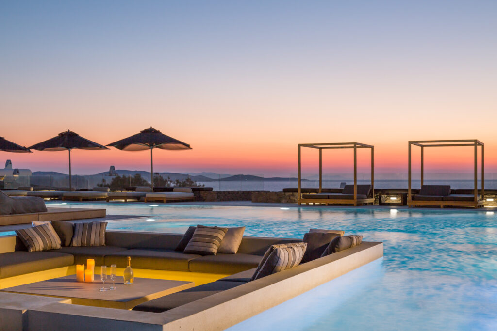 Sunken lounge and pool at sunset at Villa Arion in Aleomandra, Mykonos
