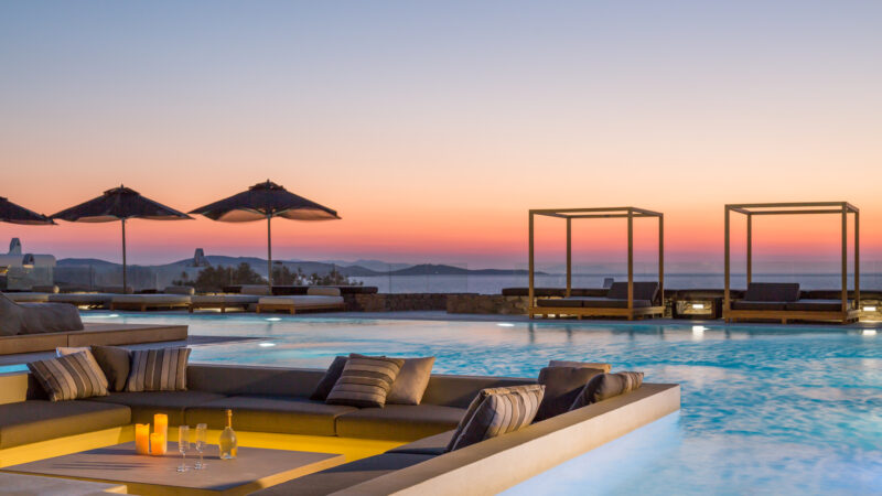 Sunken lounge and pool at sunset at Villa Arion in Aleomandra, Mykonos