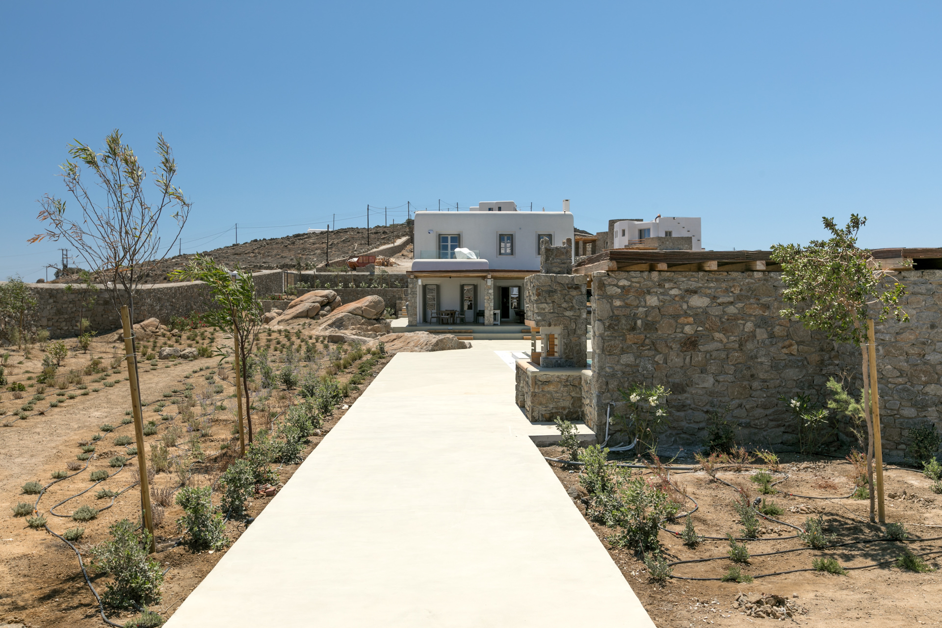 Path through the garden to the villa at Villa Arion in Aleomandra, Mykonos