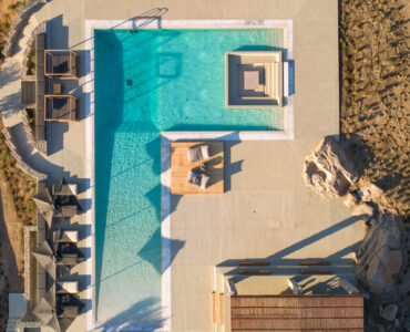 Large beach-entry pool from above at Villa Arion in Aleomandra, Mykonos