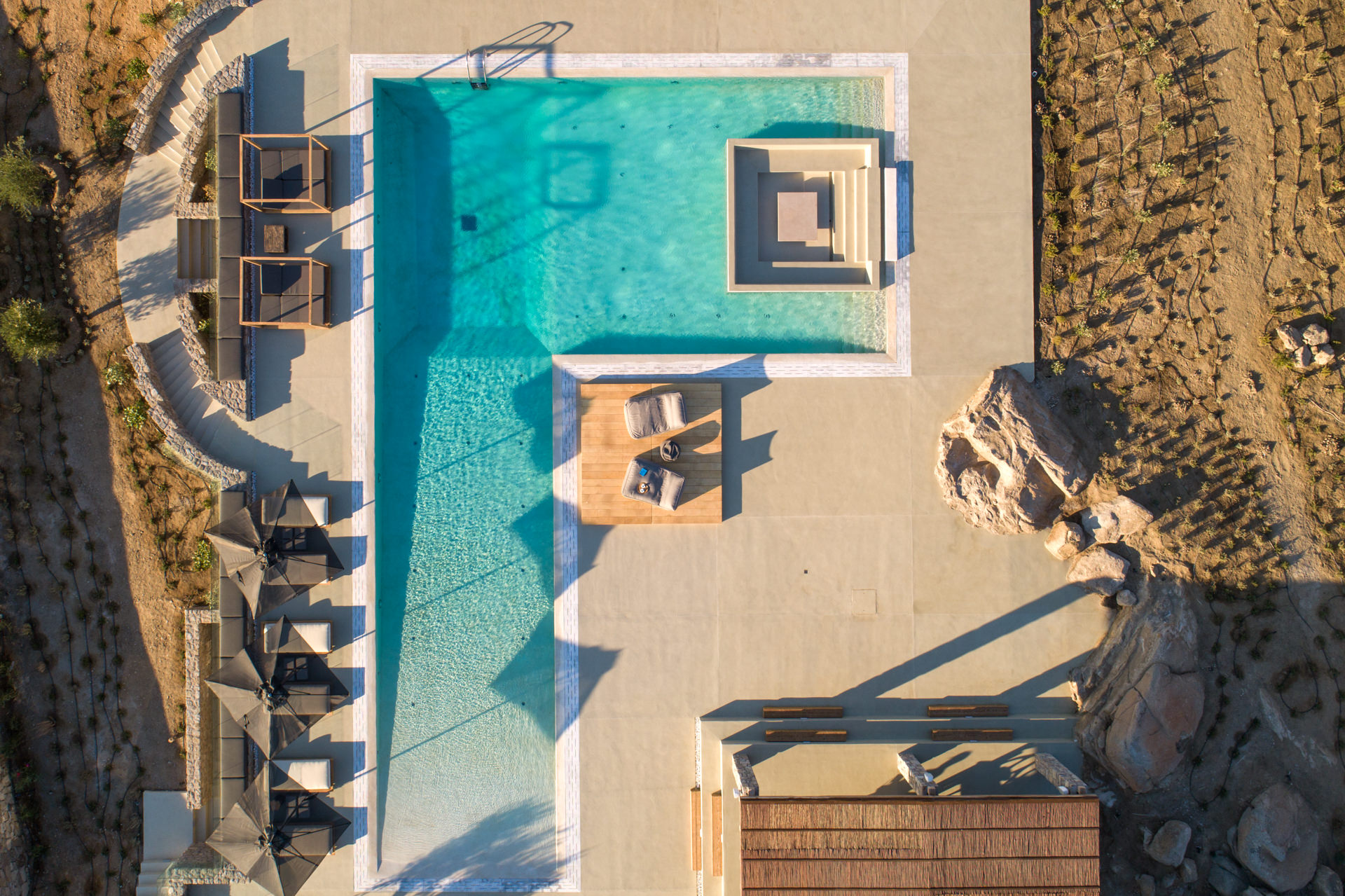 Large beach-entry pool from above at Villa Arion in Aleomandra, Mykonos