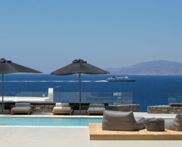 Pool lounge with sea view at Villa Arion in Aleomandra, Mykonos