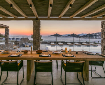 Outdoor dining table at sunset at Villa Arion in Aleomandra, Mykonos