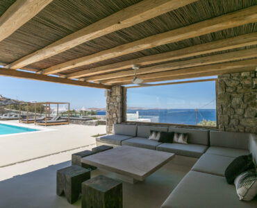 Outdoor lounge with sea view at Villa Arion in Aleomandra, Mykonos