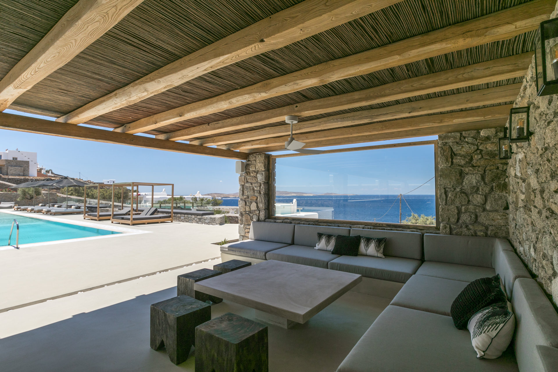 Outdoor lounge with sea view at Villa Arion in Aleomandra, Mykonos