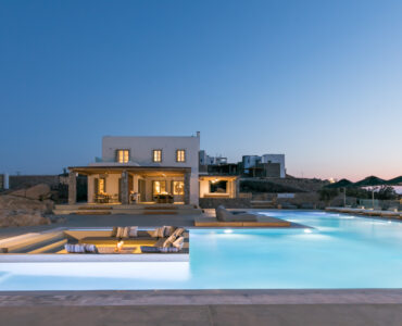 Villa and pool at dusk at Villa Arion in Aleomandra, Mykonos