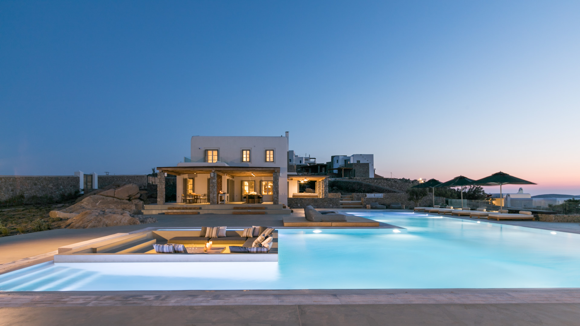 Villa and pool at dusk at Villa Arion in Aleomandra, Mykonos