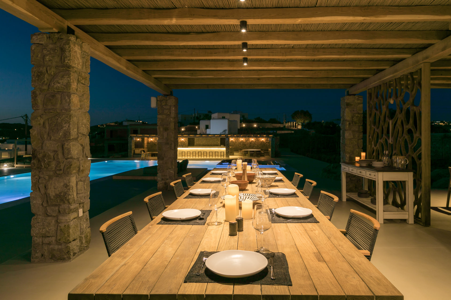 Outdoor dining table set for dinner at Villa Arion in Aleomandra, Mykonos