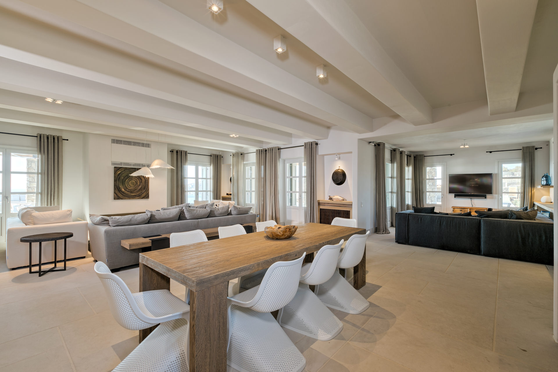 Dining area and living room at Villa Arion in Aleomandra, Mykonos