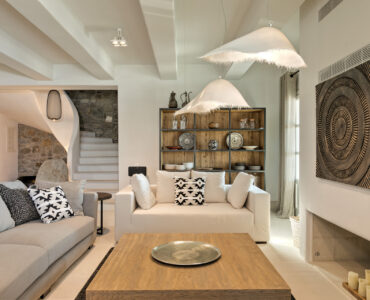Living room with curved staircase at Villa Arion in Aleomandra, Mykonos