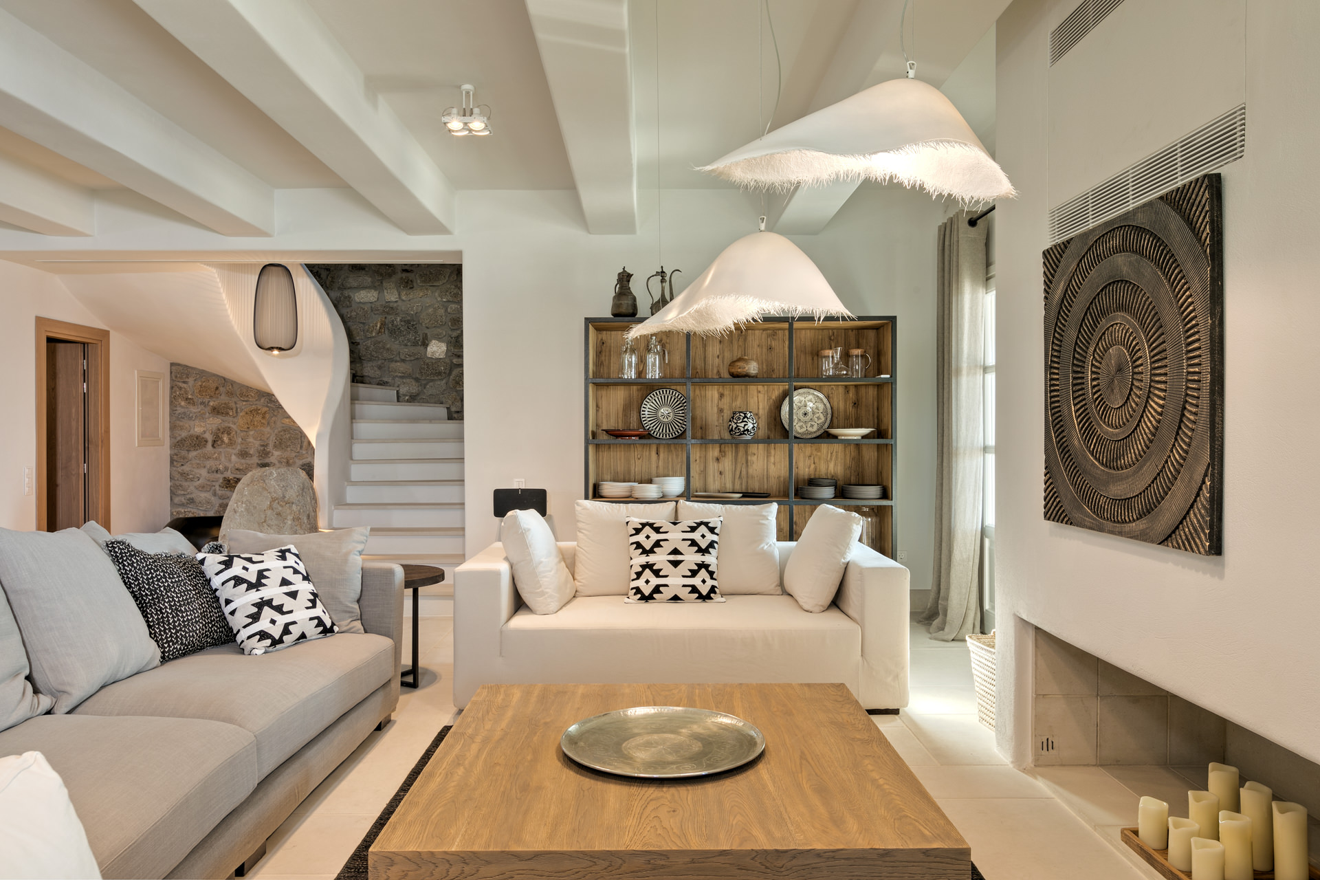 Living room with curved staircase at Villa Arion in Aleomandra, Mykonos