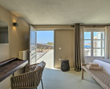Guest room with terrace door at Villa Arion in Aleomandra, Mykonos