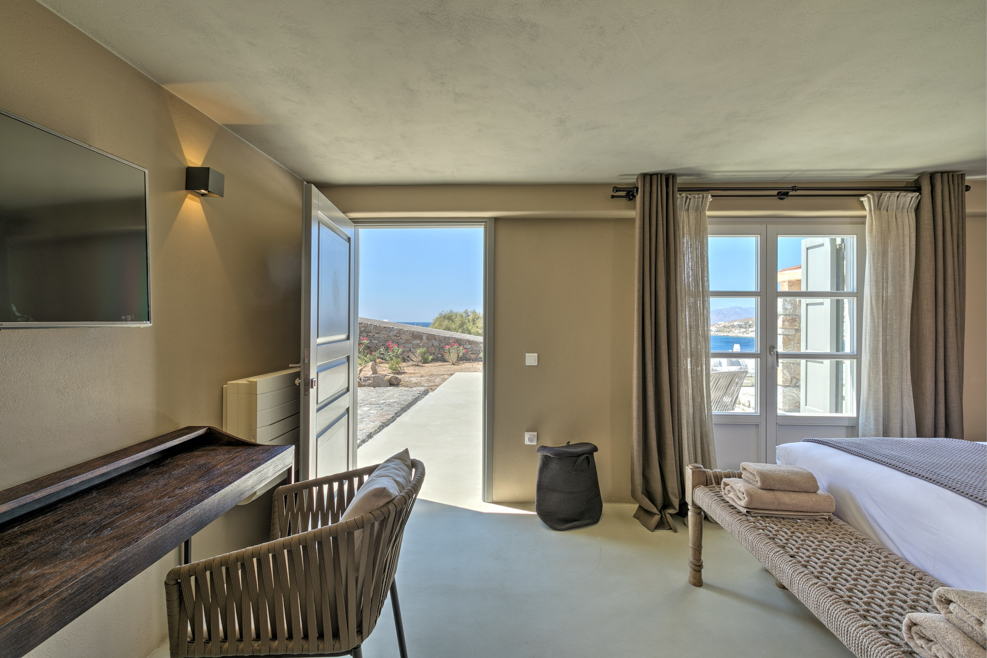 Guest room with terrace door at Villa Arion in Aleomandra, Mykonos
