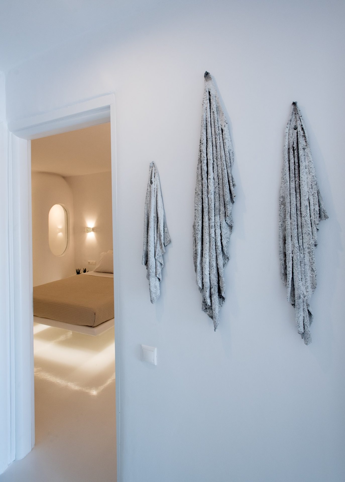 Hallway with artwork at Villa Costa in Elia, Mykonos