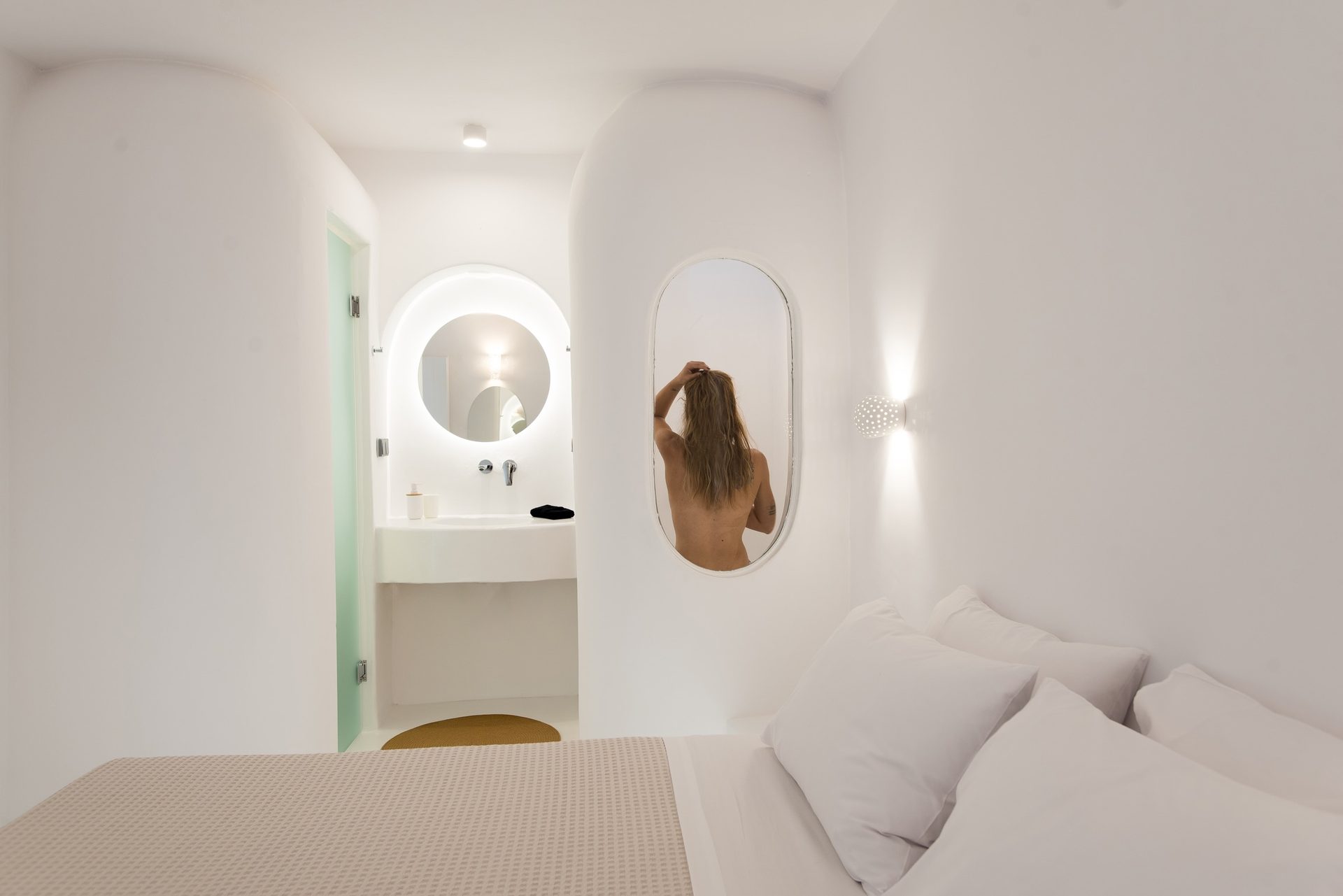 Bedroom with arched niche at Villa Costa in Elia, Mykonos