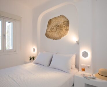 Bedroom with stone detail at Villa Costa in Elia, Mykonos