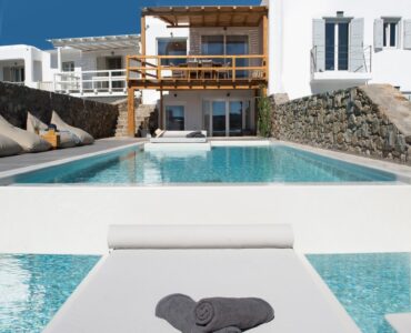 Pool with in-water sun deck at Villa Costa in Elia, Mykonos