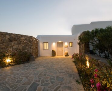 Entrance courtyard at dusk at Villa Costa in Elia, Mykonos