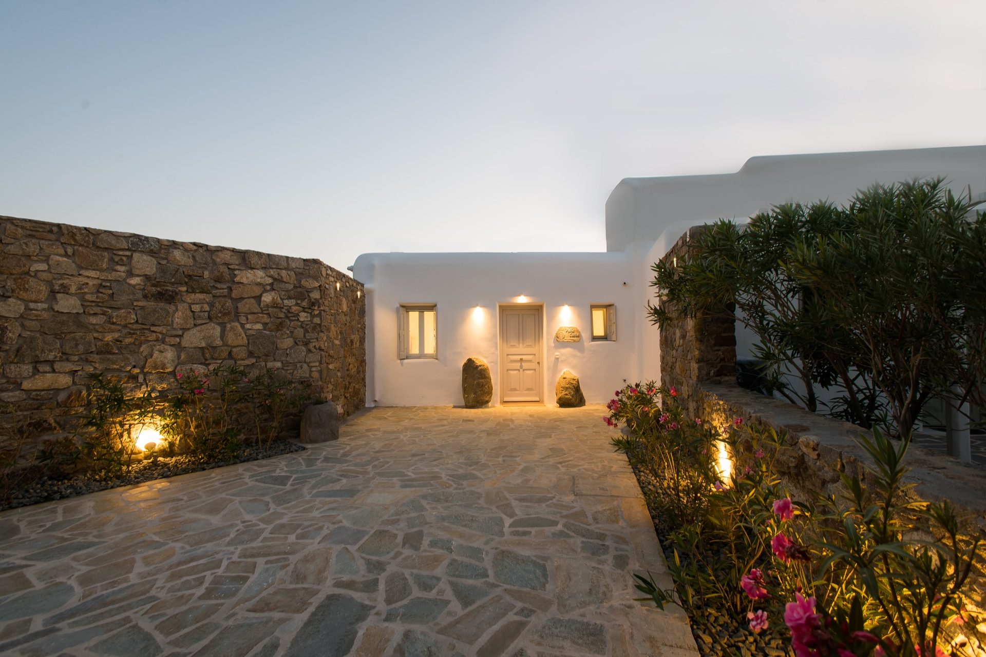Entrance courtyard at dusk at Villa Costa in Elia, Mykonos