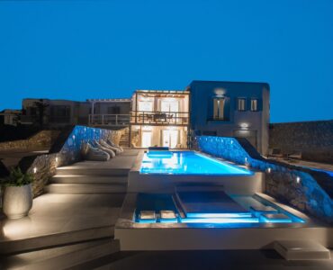 Villa and pool lit at night at Villa Costa in Elia, Mykonos