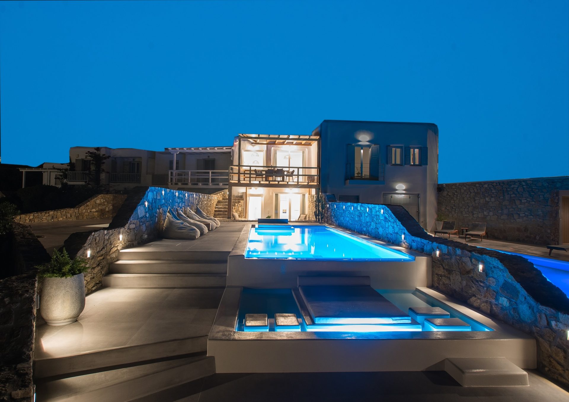 Villa and pool lit at night at Villa Costa in Elia, Mykonos