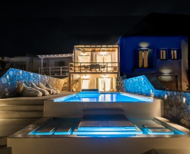 Pool and villa at night at Villa Costa in Elia, Mykonos