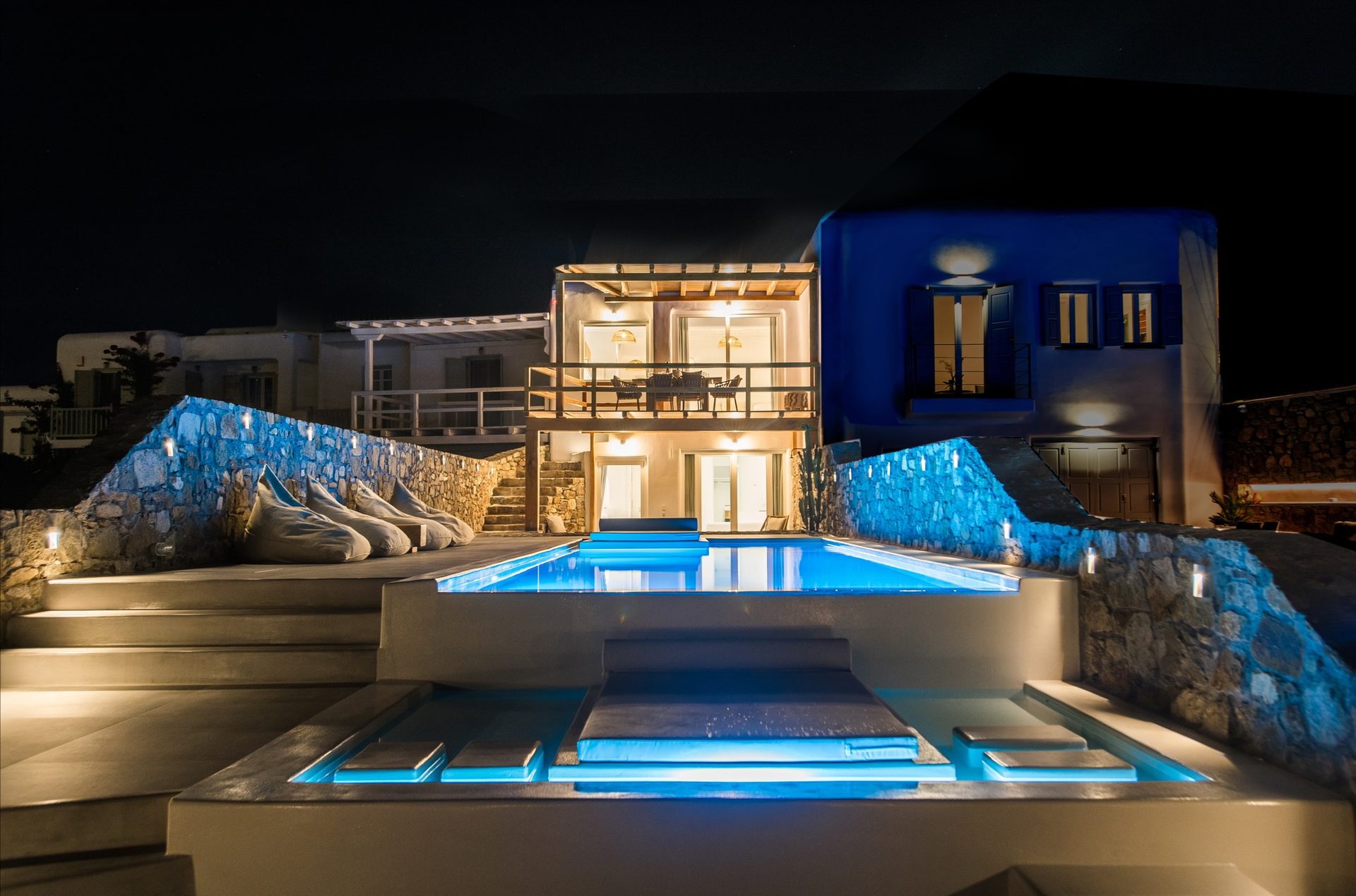 Pool and villa at night at Villa Costa in Elia, Mykonos
