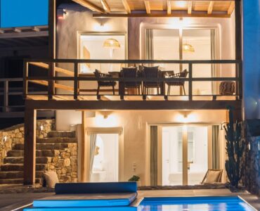 Pool lit at night at Villa Costa in Elia, Mykonos