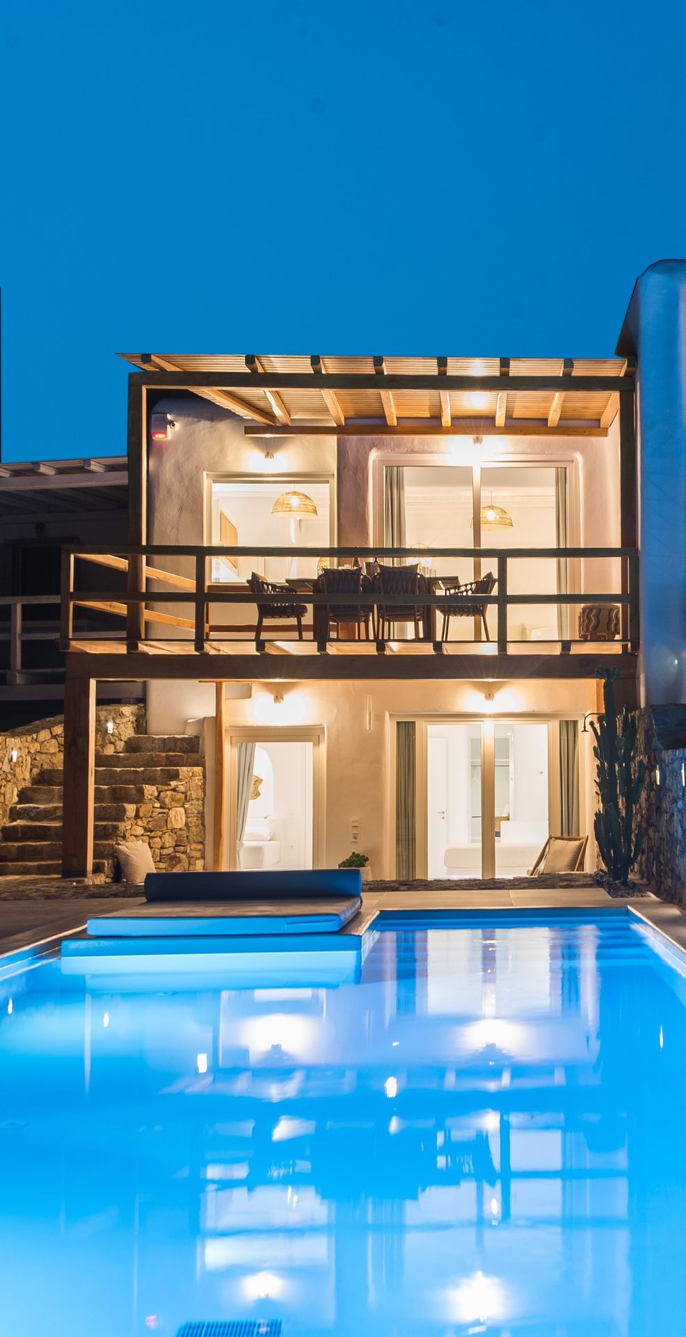 Pool lit at night at Villa Costa in Elia, Mykonos