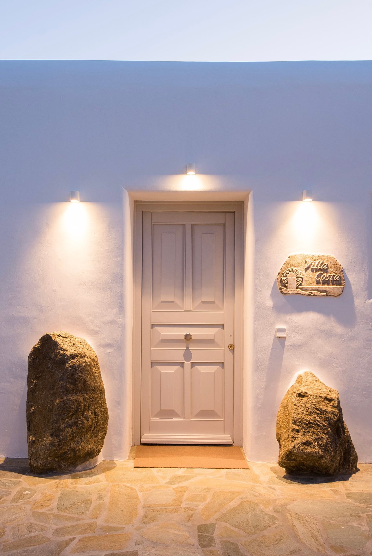 Entrance door with stone details at Villa Costa in Elia, Mykonos