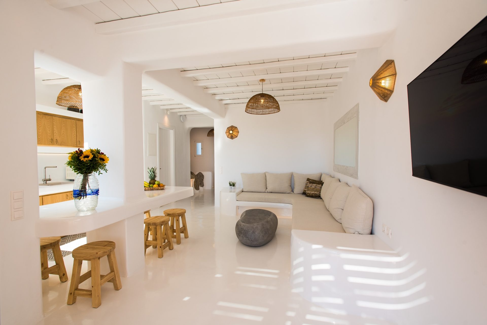 Open-plan living and dining area at Villa Costa in Elia, Mykonos