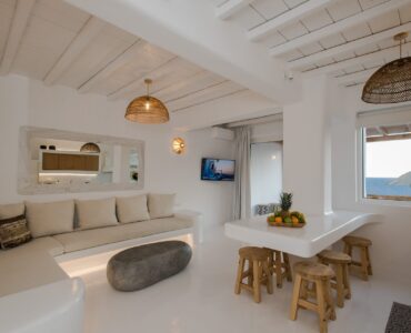 Living room with built-in sofa at Villa Costa in Elia, Mykonos