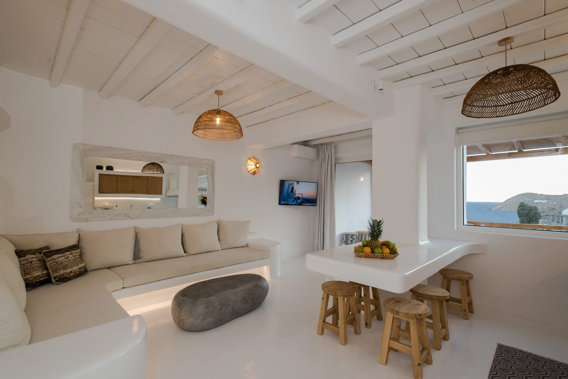 Living room with built-in sofa at Villa Costa in Elia, Mykonos