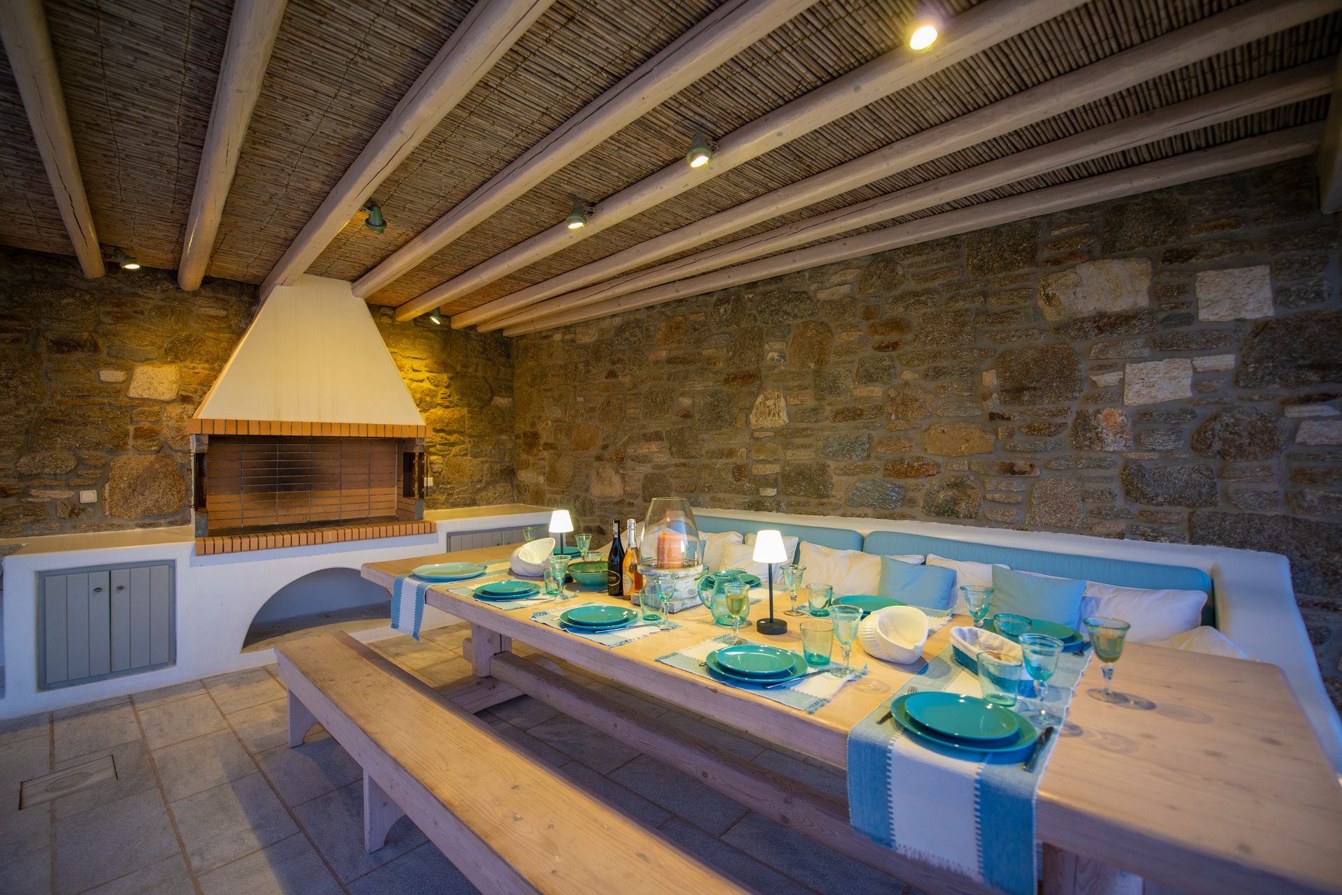Pergola dining area with stone wall at Villa Danelina in Agios Lazaros, Mykonos