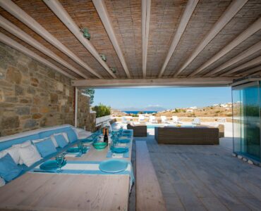 Covered lounge with built-in sofas at Villa Danelina in Agios Lazaros, Mykonos