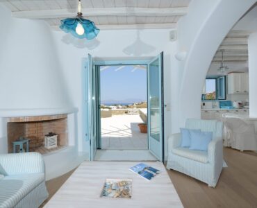 Living room with sea-view door at Villa Danelina in Agios Lazaros, Mykonos