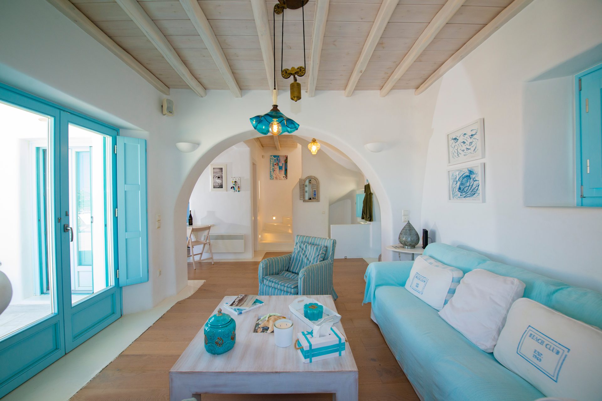Living room with arched opening at Villa Danelina in Agios Lazaros, Mykonos