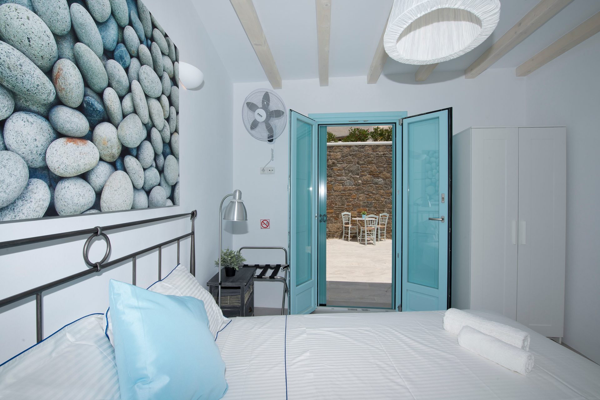 Bedroom with terrace doors at Villa Danelina in Agios Lazaros, Mykonos