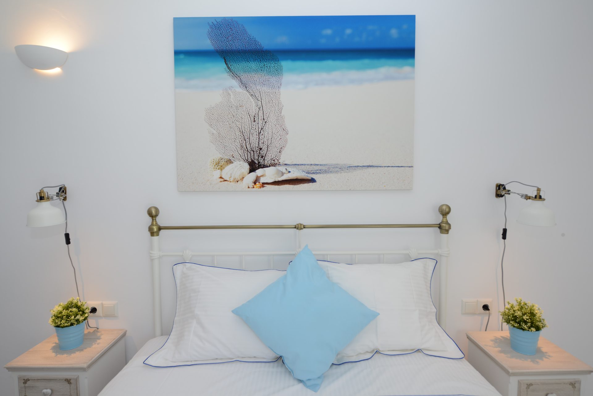 Double bedroom with artwork at Villa Danelina in Agios Lazaros, Mykonos