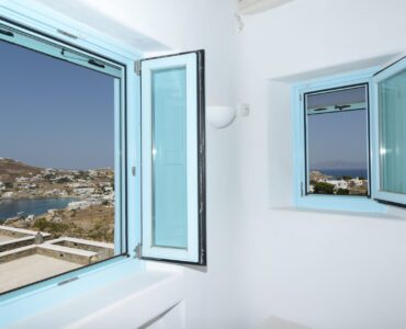 Bedroom window with sea view at Villa Danelina in Agios Lazaros, Mykonos
