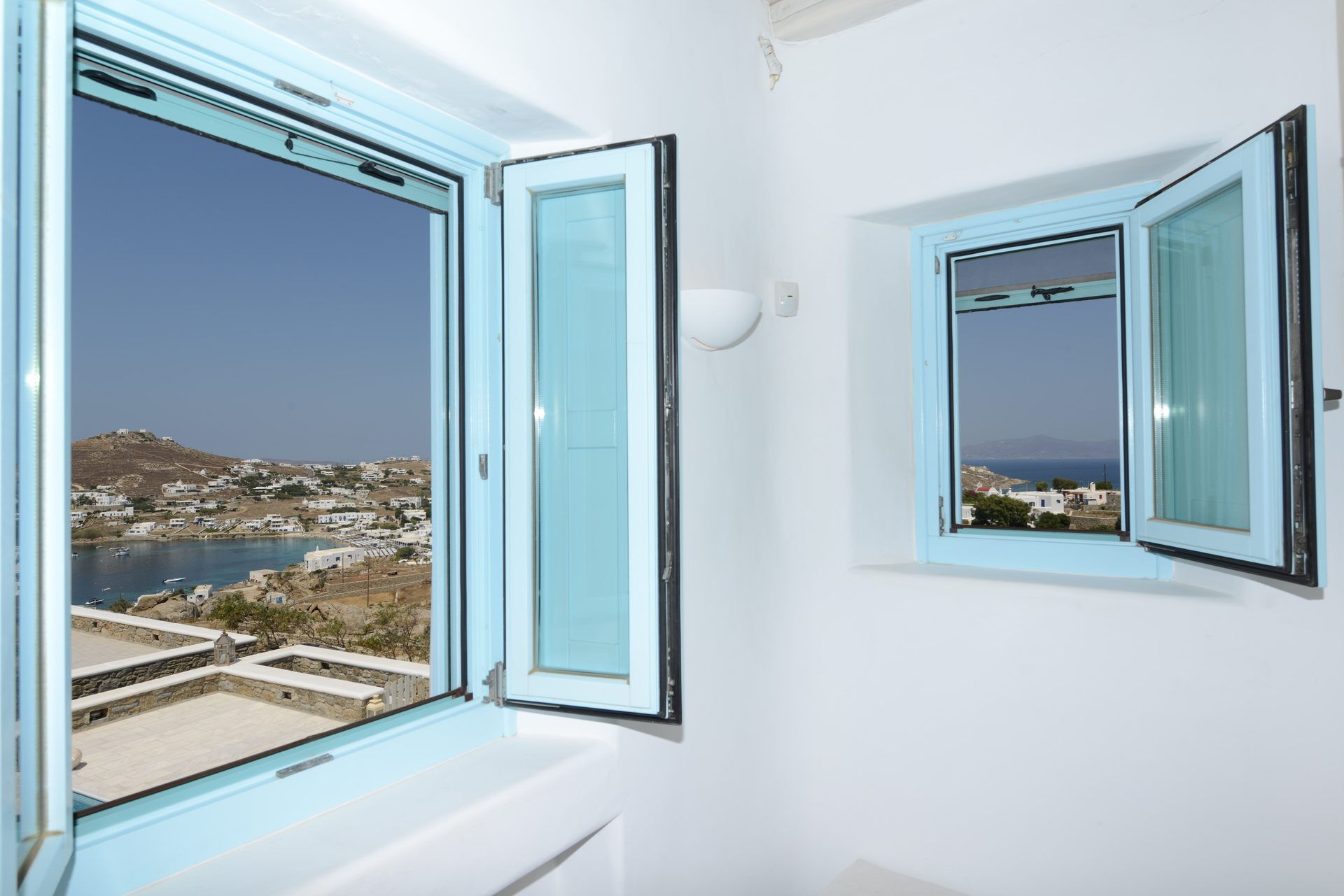 Bedroom window with sea view at Villa Danelina in Agios Lazaros, Mykonos
